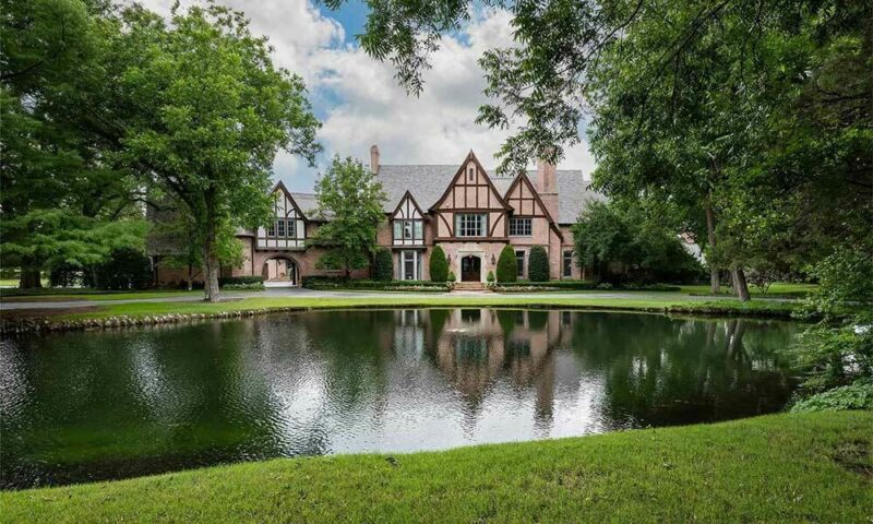 Brick mansion seen from across a pond