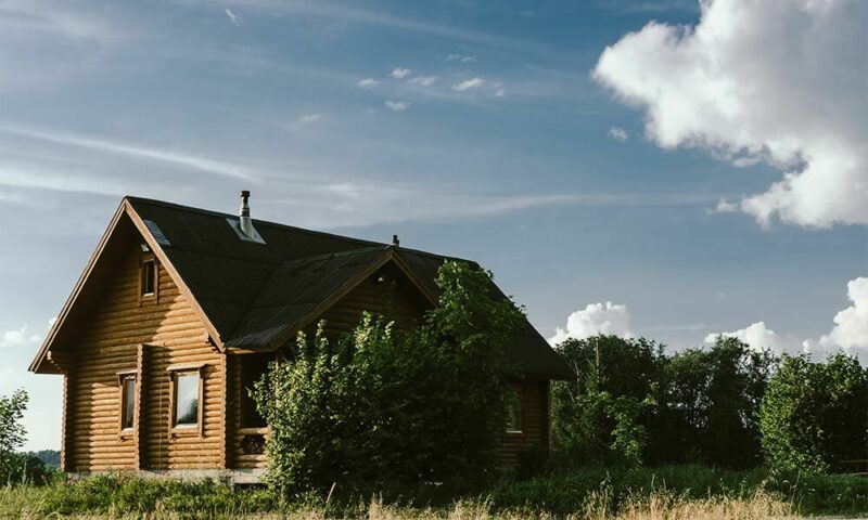 Log cabin in a meadow