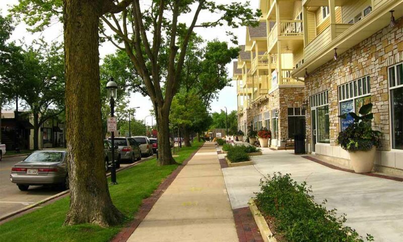 Shops along a street that have apartments above them.