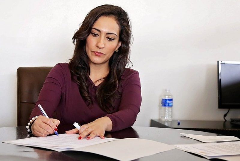 Woman working on document collection