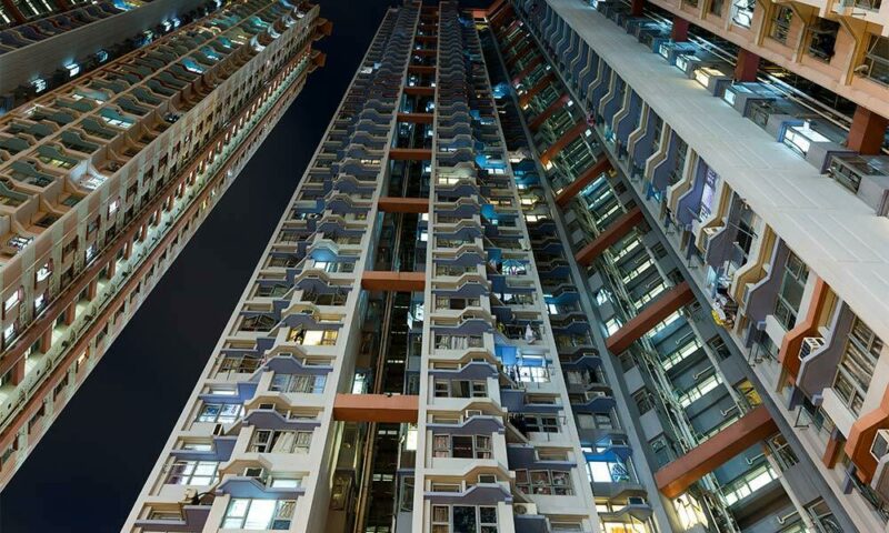 Angled view of apartments at night.