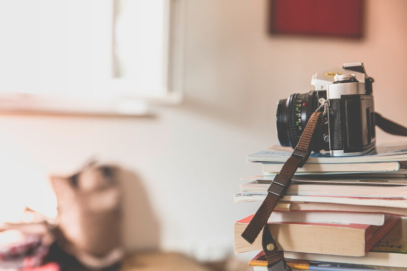 camera sitting on books