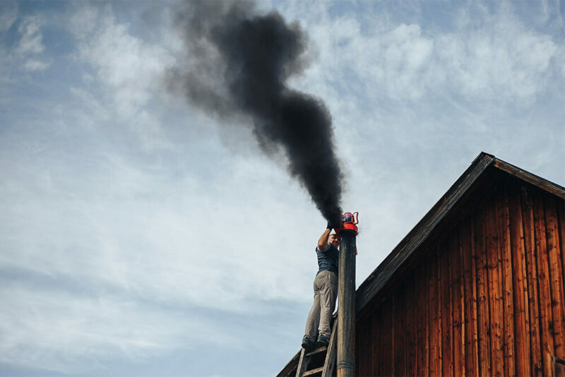 man cleaning a chimney