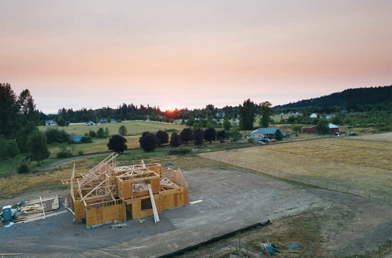 Aerial shot of new home construction at sunset