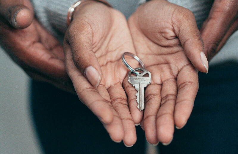 couple holding house keys in their hands