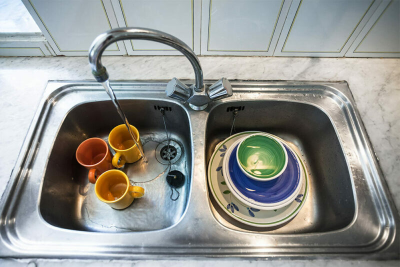 Dirty dishes in a kitchen sink