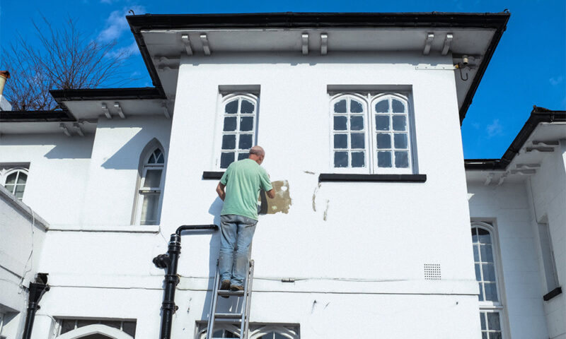 man doing DIY repairs on his home