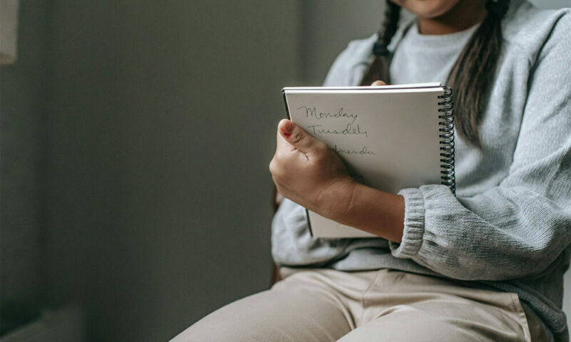 Girl Writing an Essay