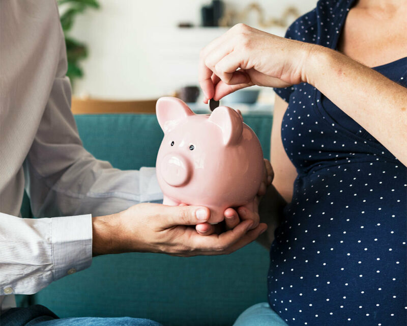 Family saving money with a piggy bank