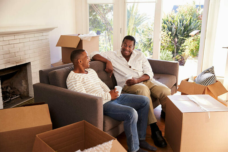 Father and adult son on moving day