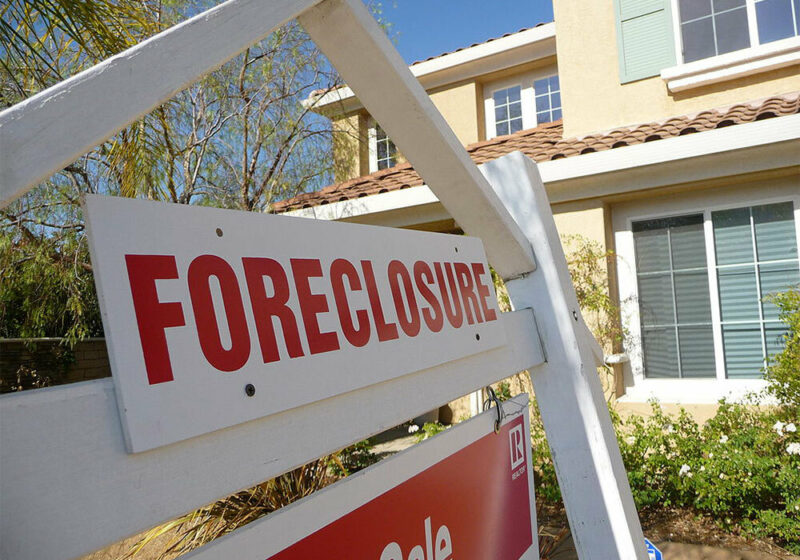 Foreclosure sign in front of house