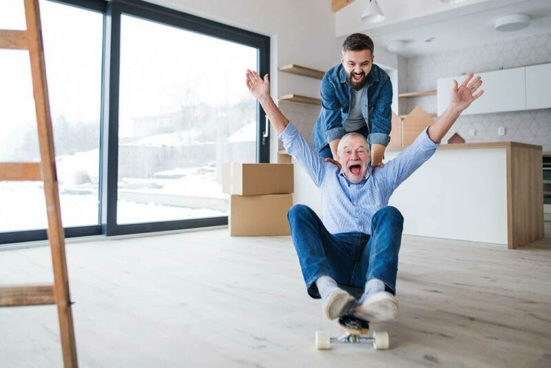 Senior man and his son moving into a new home