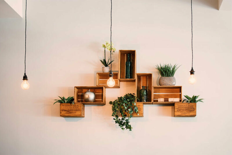 hanging shelves on a living room wall