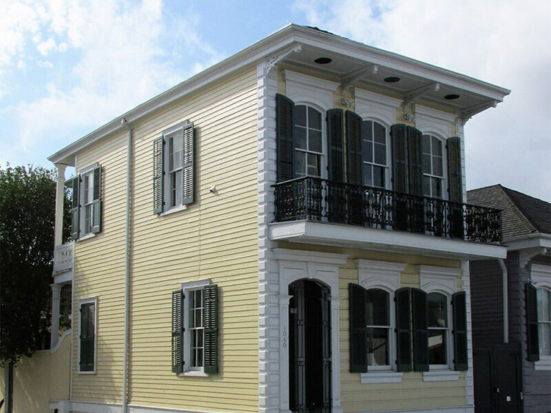 exterior photo of an older house with tall ceilings