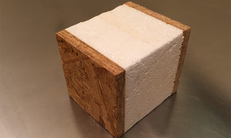Insulation foam between two squares of plywood.