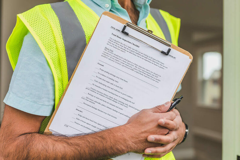 insurance inspector with a clipboard