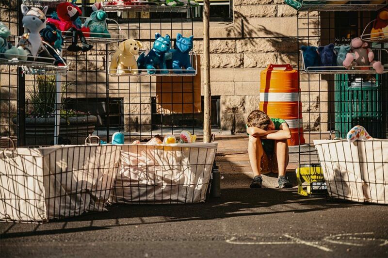 Exhausted kid moving with toys