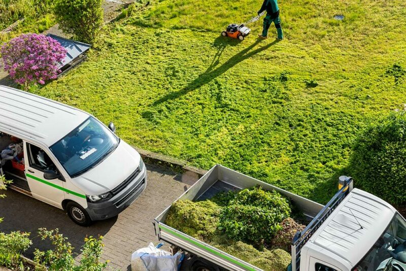 landscaping company mowing a lawn