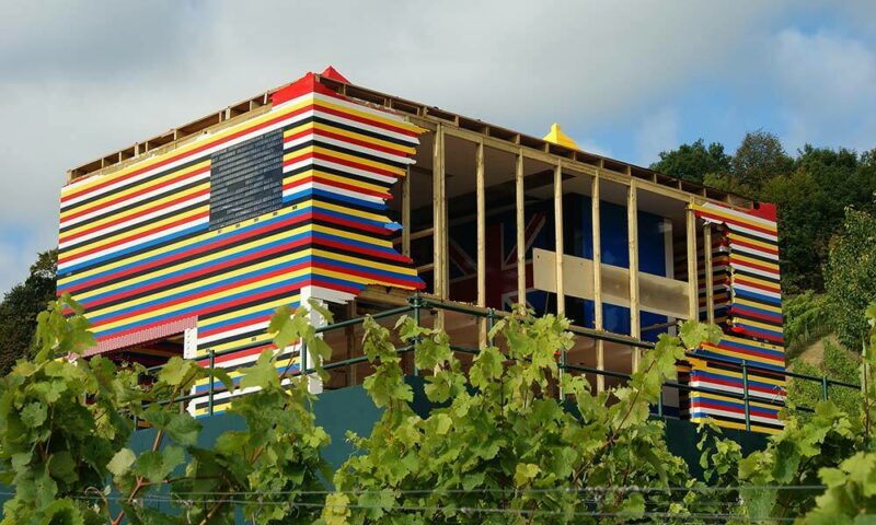 House made of LEGOs in England among the trees.