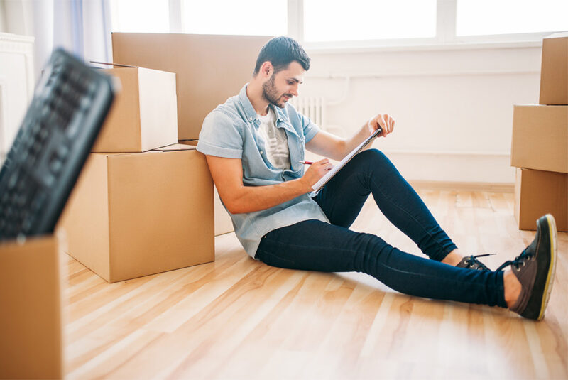 man laying on hard wood floor