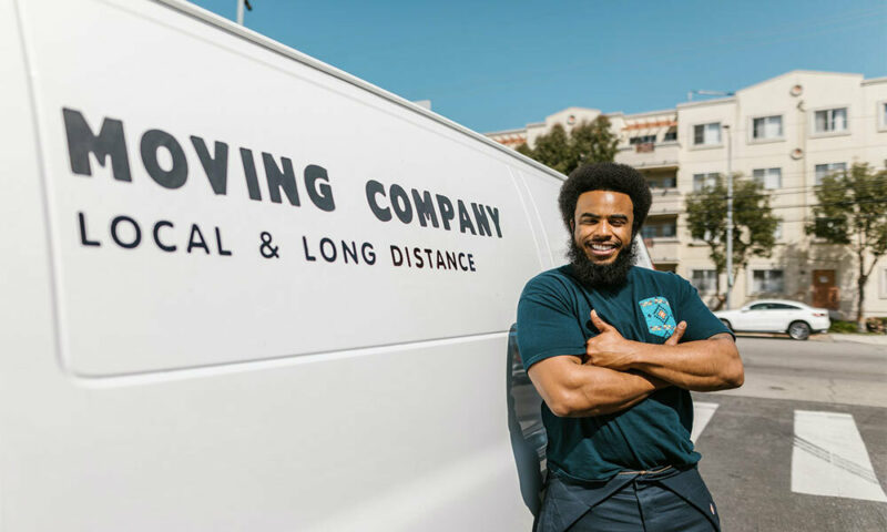 man standing by moving van