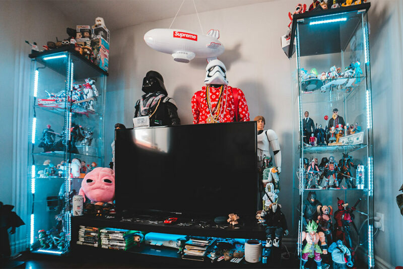 nerdy custom living room with action figures galore, some even life-size