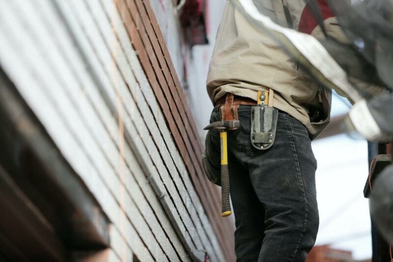 Handyman with a hammer in his toolbelt
