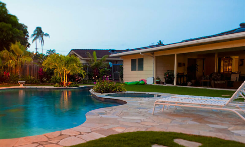 house with a pool in the back yard