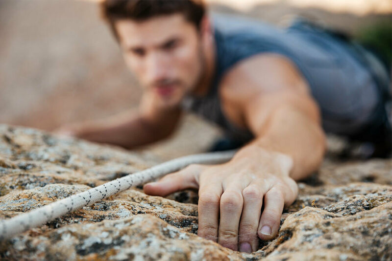 man rock climbing