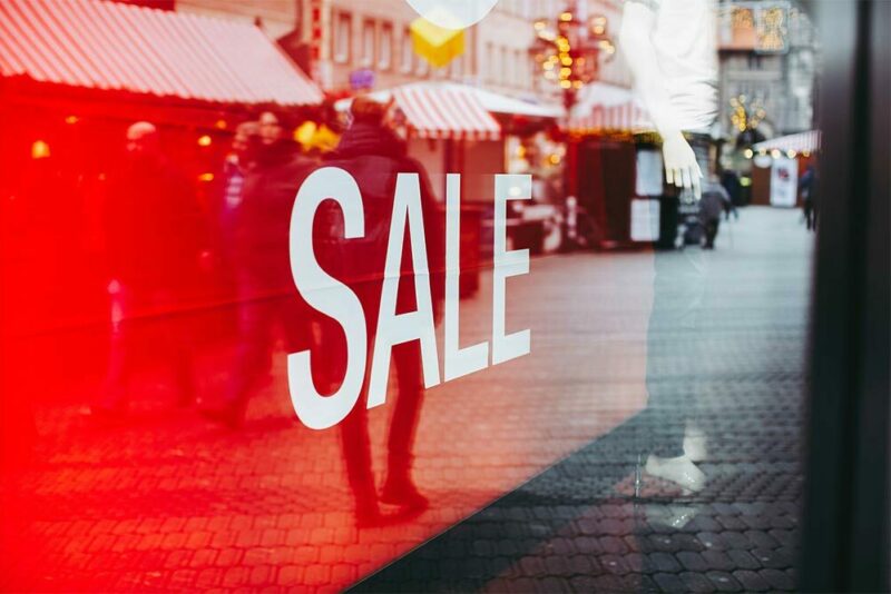 sale sign in a glass window