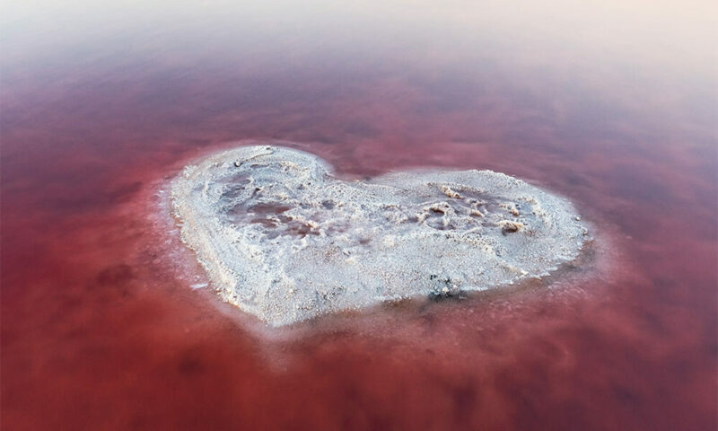 A large salt flat in the shape of a heart.