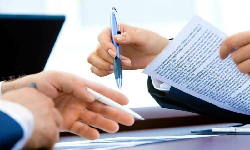signing documents in an office