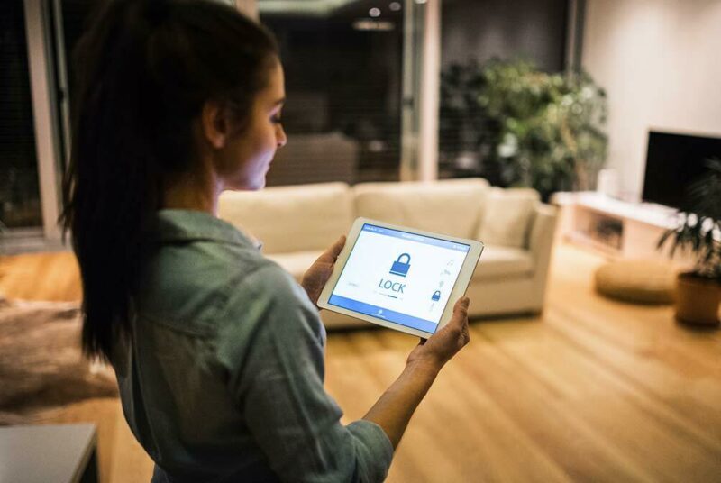 woman looking at tablet