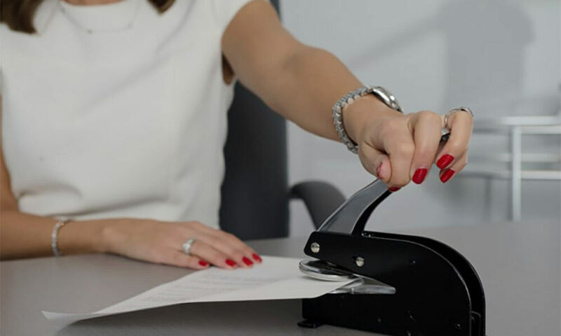 Business woman with a stapler