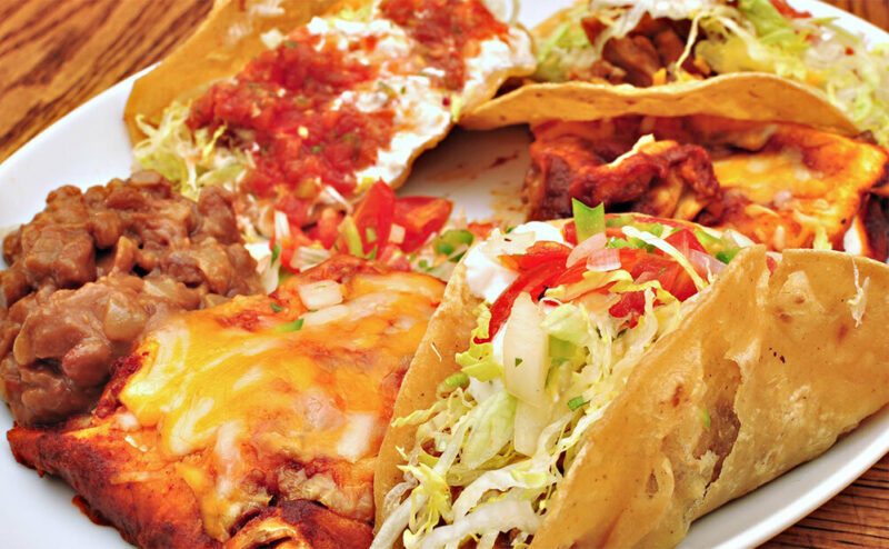 Tex-Mex plate with tacos, chalupas, and beans