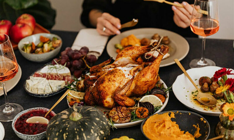 Thanksgiving turkey in middle of dinner table