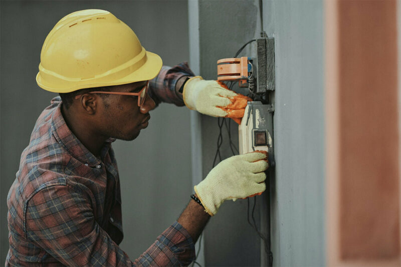 electrician upgrading breaker box