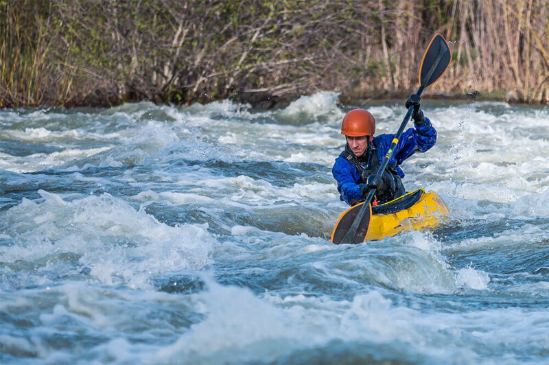 man whitewater rafting