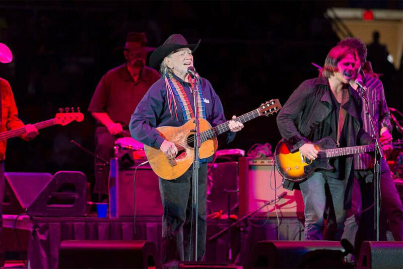 Willie Nelson performing onstage