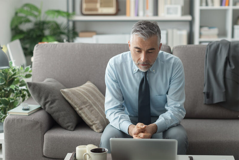 Man working from home at coffee table